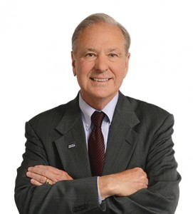 Picture of man in suit with arms folded